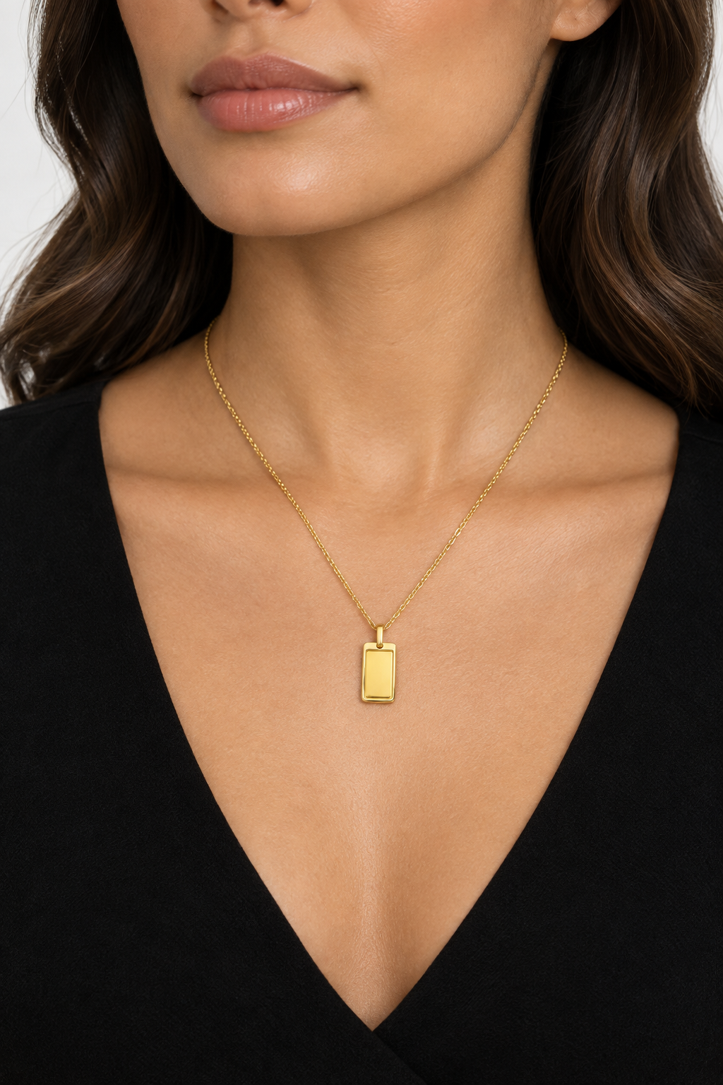 Woman wearing gold bar pendant necklace
